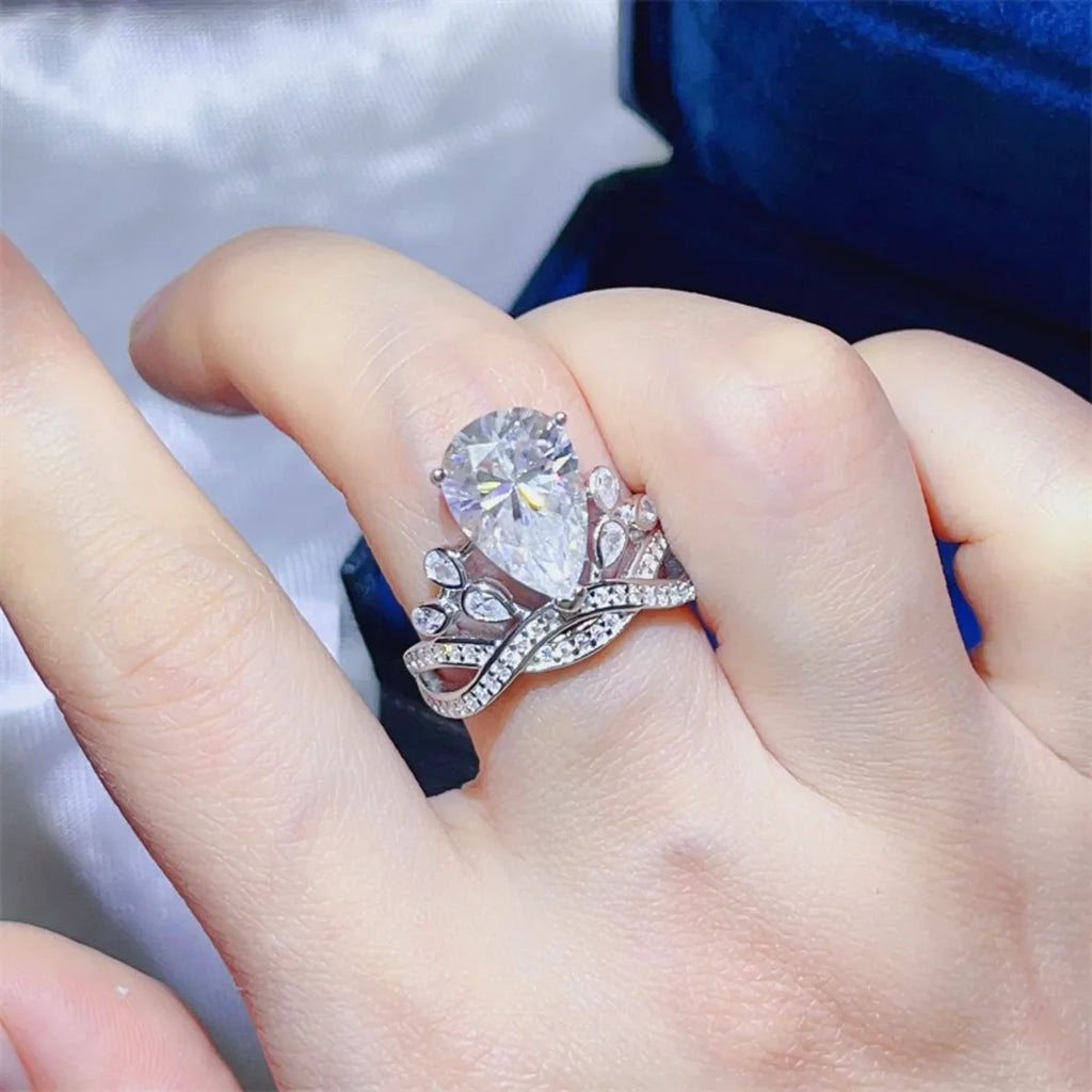 Sterling silver ring with 5 carat moissanite gemstone, elegant jewelry design, showcasing sparkling center stone and polished band