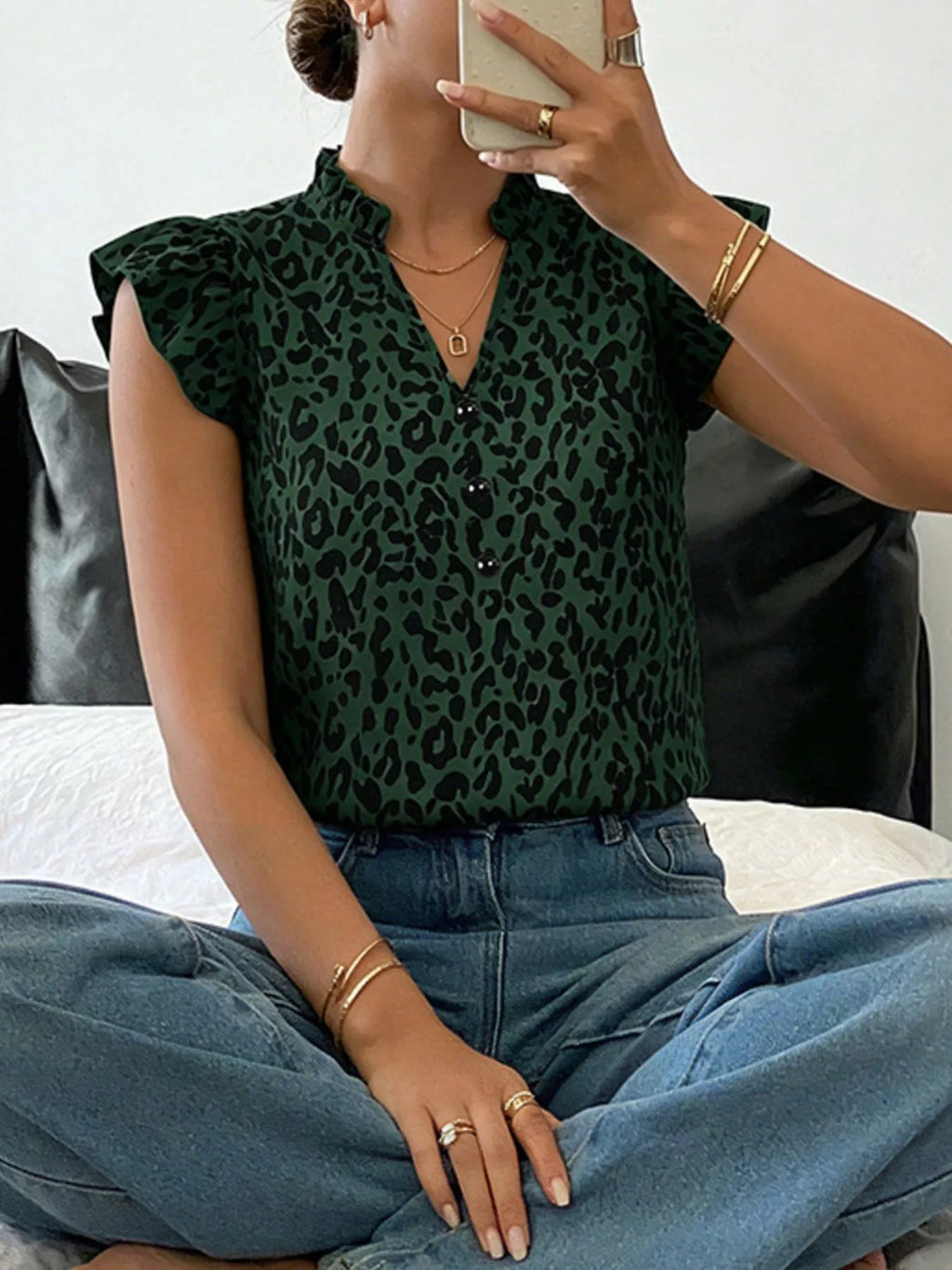 Leopard print ruffle sleeve blouse by Plush Fashion Hub, featuring stylish ruffles and vibrant animal print fabric.