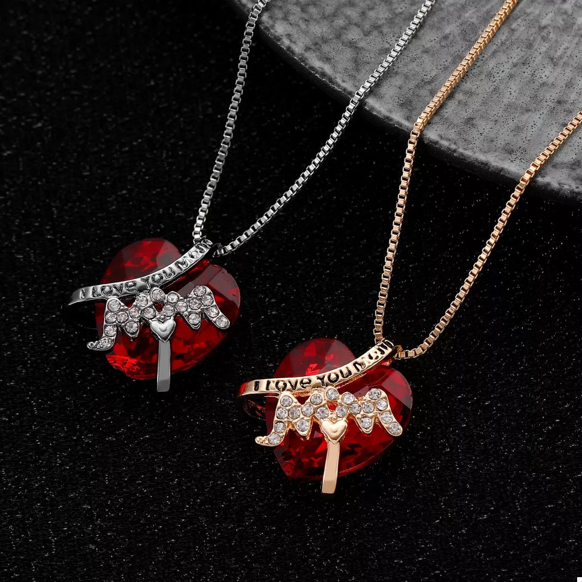 Heart-shaped MOM pendant necklace by Plush Fashion Hub with a silver chain and a shiny heart charm.