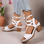 Women's lace-up block heel sandals with strappy design and mid-height heel, stylish shoe by Trendsi.