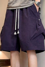 Plus size men's drawstring shorts with pockets, featuring a rings detail, from Trendsi. Gray fabric, casual fit, front and back view.