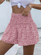 Floral print elastic waist shorts from Trendsi featuring colorful flower patterns and a comfortable fit.
