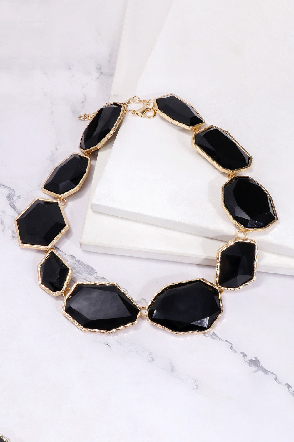 Geometrical resin necklace with zinc alloy frame, showcasing modern design and vibrant colors, from Plush Fashion Hub.