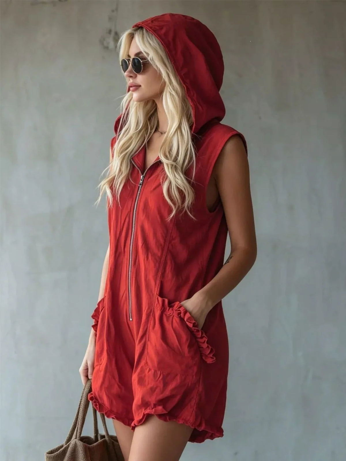 Plus size hooded sleeveless zipper romper with ruffled pockets from Plush Fashion Hub, featuring a full-size fit and stylish design.