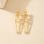 Gold-plated skeleton earrings with Halloween-themed design from Shopimist, featuring intricate skeletal detailing on dangling earrings.