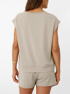 Women's soft round neck cap sleeve lounge set with drawstring shorts from Plush Fashion Hub, shown on a model.