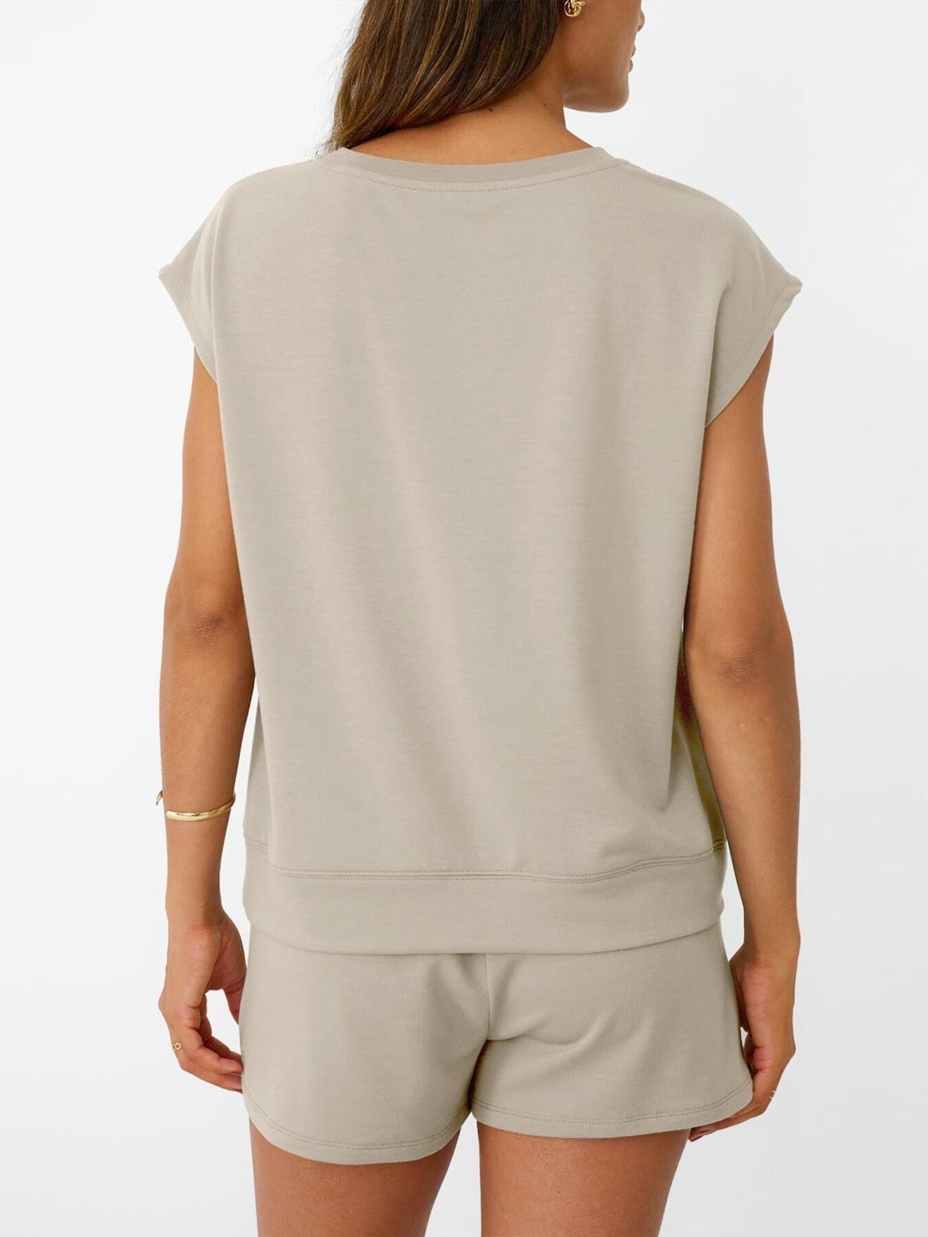 Women's soft round neck cap sleeve lounge set with drawstring shorts from Plush Fashion Hub, shown on a model.