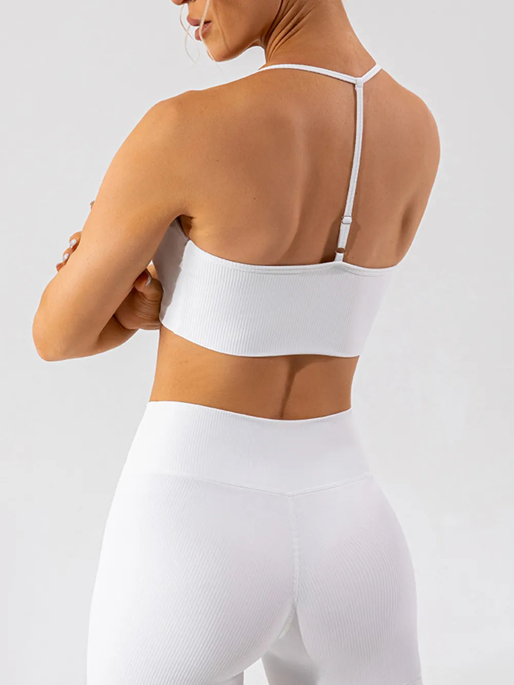 Trendsi Spaghetti Strap Active Bra in black, lightweight activewear with thin straps, perfect for workouts and athletic activities.