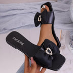 Open toe bow sandals by Trendsi featuring stylish design, open toe front, and bow detail, perfect for warm weather footwear.