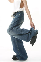 Wide leg jeans with pockets from Trendsi, featuring a relaxed fit and classic denim style, shown on a model.