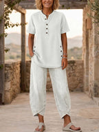 Women's FitiqueFit lapel button-up top and pants two-piece set with three-quarter sleeves, stylish coordinated outfit.