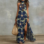 Women's sleeveless floral print maxi dress by FitiqueFit featuring a split design and vibrant floral pattern.
