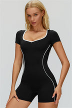 Fitglutes Activewear The Whisper Romper in black, featuring a sleek workout romper with supportive fit and stylish design.
