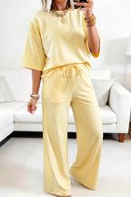 Plush Fashion Hub rings set featuring a half sleeve top and drawstring pants with decorative rings details.