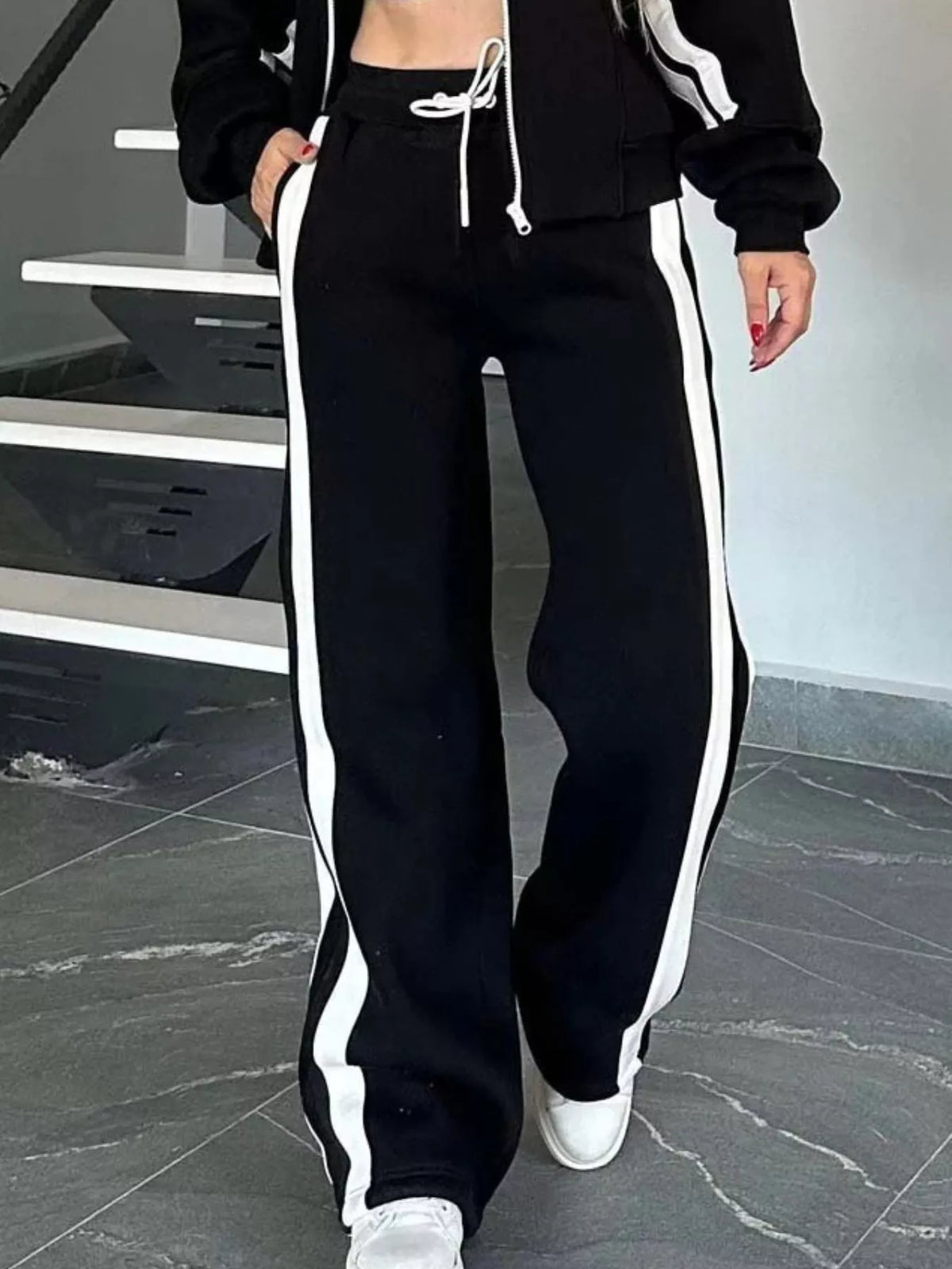 Plus size contrast stripe zip-up activewear jacket and pants set in black and white by Plush Fashion Hub, stylish athletic wear.