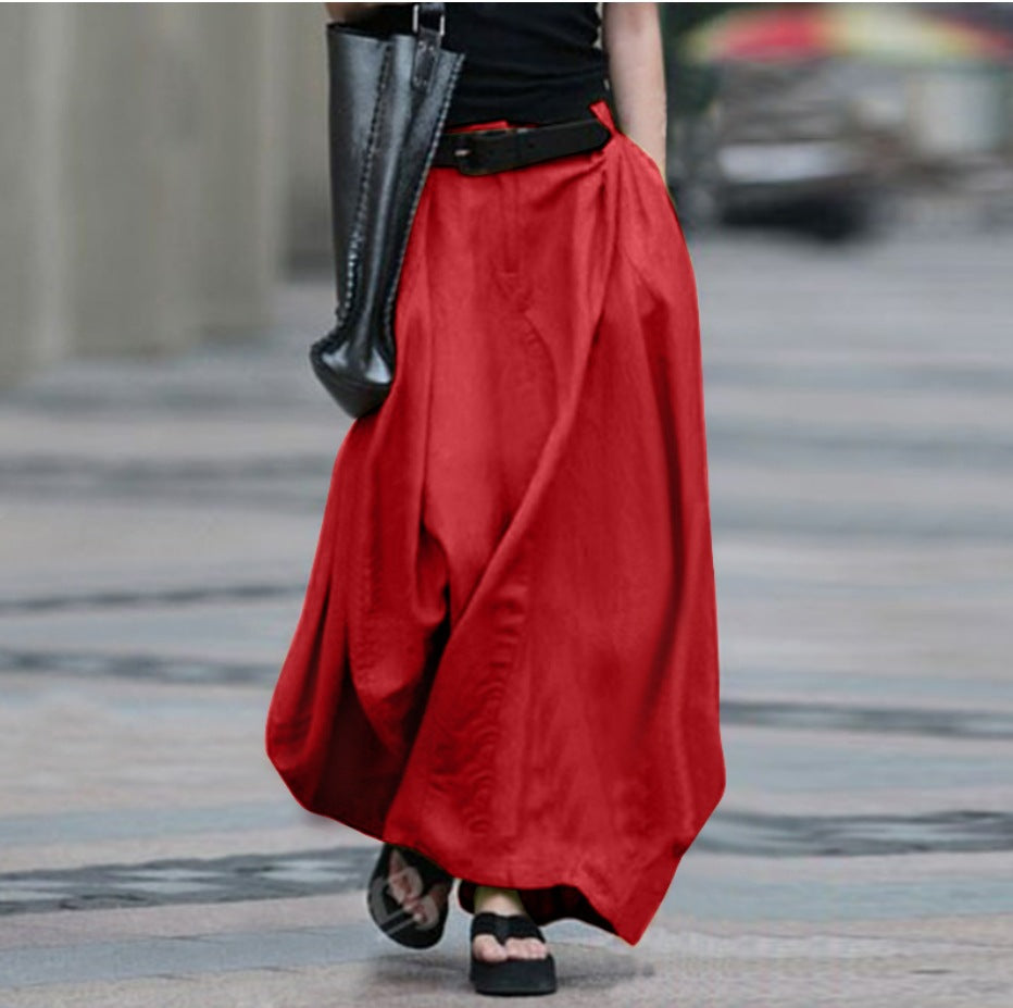 Women's high-waist flared maxi skirt in solid cotton linen with pockets, from Plush Fashion Hub, displayed on a model.