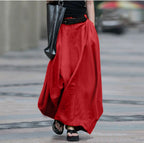 Women's high-waist flared maxi skirt in solid cotton linen with pockets, from Plush Fashion Hub, displayed on a model.