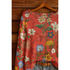 Women’s fall wildflower print long sleeve T-shirt by Plush Fashion Hub, featuring a colorful floral pattern on casual wear.