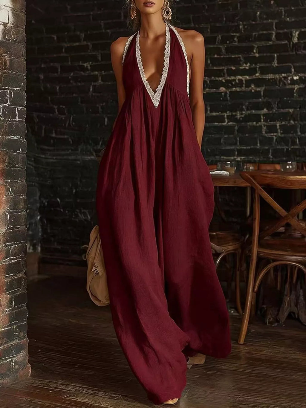 Plus size halter neck jumpsuit with lace trim and wide leg design by Shopimist, shown in full length on a model.