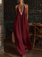 Plus size halter neck jumpsuit with lace trim and wide leg design by Shopimist, shown in full length on a model.