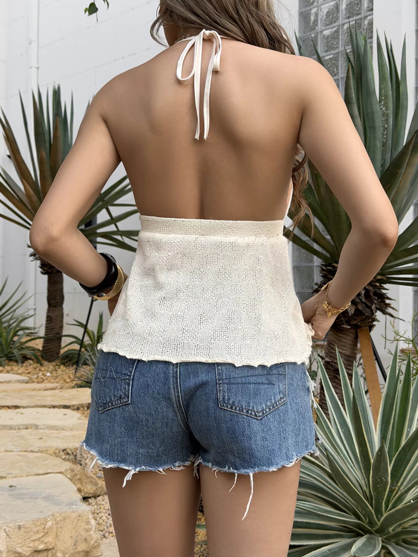 Shell halter neck cami top from Trendsi featuring a woven shell pattern and halter strap, perfect for stylish summer outfits.