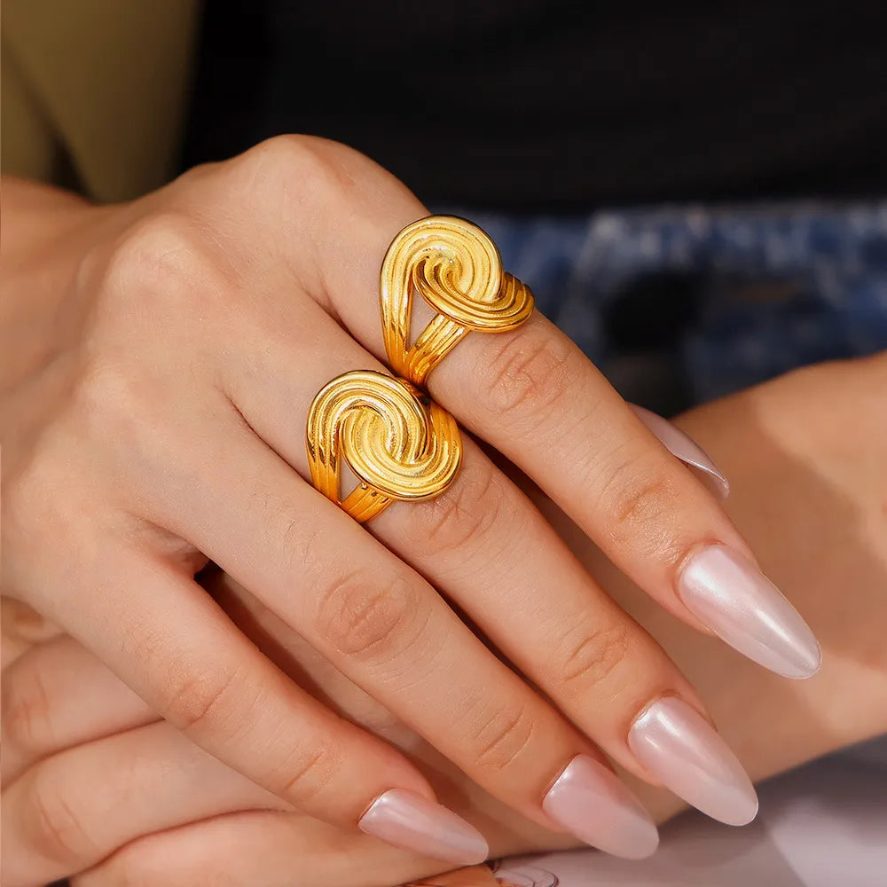 Gold-plated twisted ring from Plush Fashion Hub, featuring a stylish design and shiny 18K gold finish.