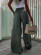 Flowy wide-leg pants by Trendsi featuring a relaxed fit and lightweight fabric, perfect for casual or stylish everyday wear.