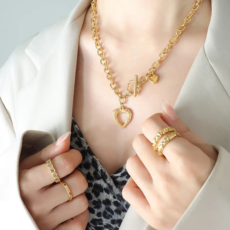 Titanium steel heart pendant necklace from Plush Fashion Hub featuring a sleek, modern design on a delicate chain.