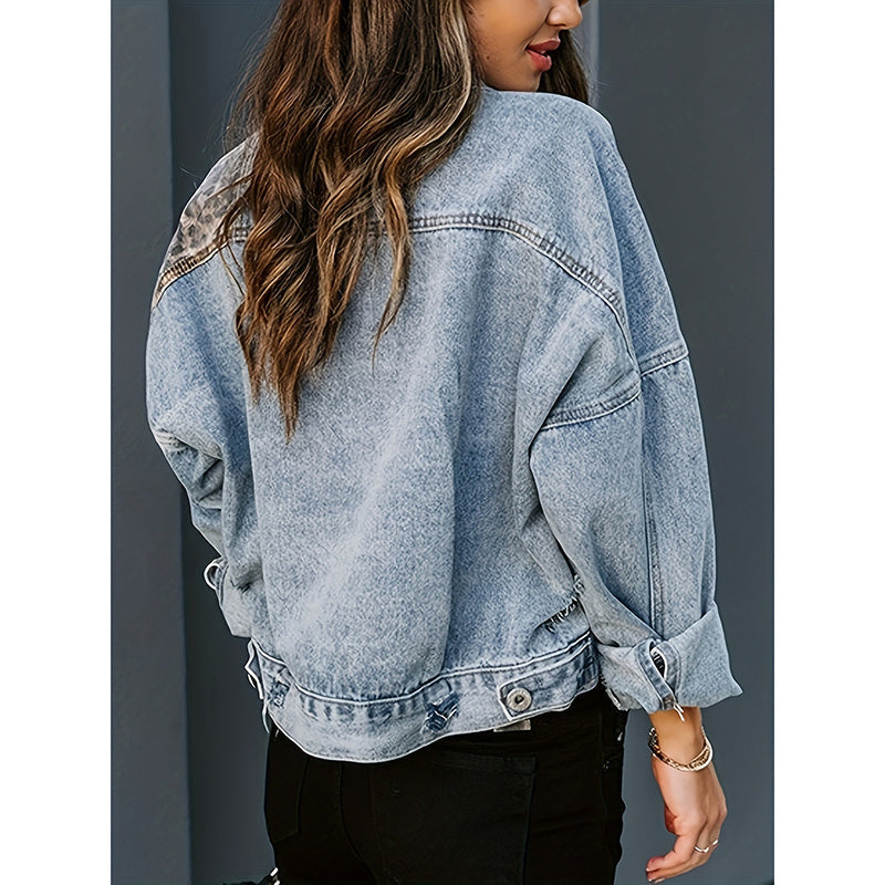 Women's distressed cropped denim jacket by FitiqueFit, casualwear with frayed details and a trendy fit, shown on a model.