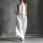 Women’s casual sleeveless top and high-waist wide-leg pants set by Plush Fashion Hub in four colors, displayed on a model.