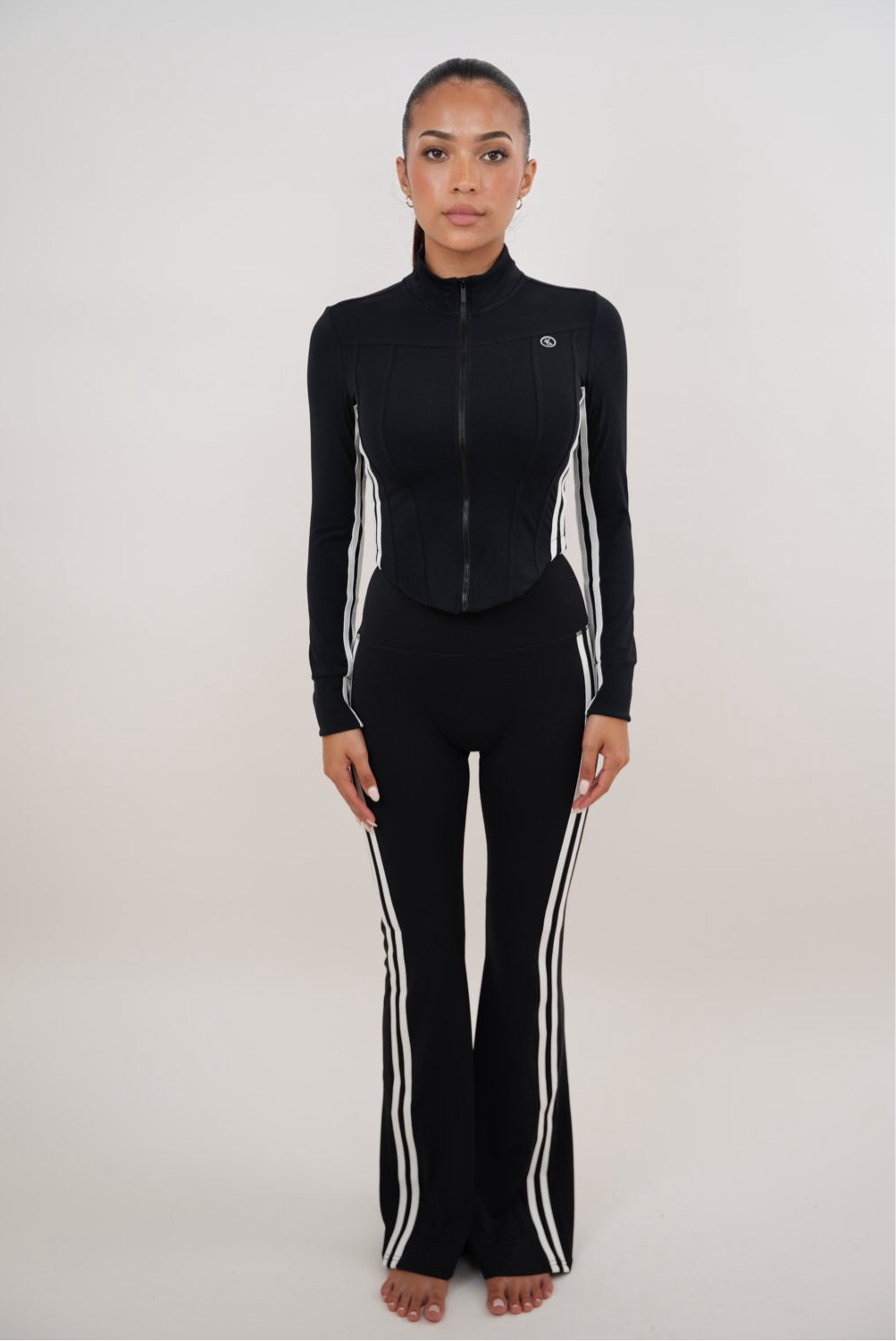 Black flare leggings for women by Plush Fashion Hub, featuring a fitted legging style with flared hems for a stylish look.