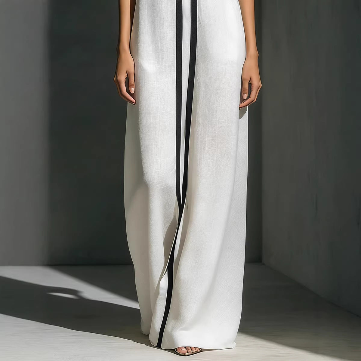 Modern V-neck color-block wide-leg jumpsuit by eprolo, featuring a stylish V-neck design and bold color-block pattern.