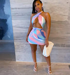 Colorful rainbow tie dye halter bodycon mini dress for women, showcasing a fitted sleeveless design with vibrant patterns.