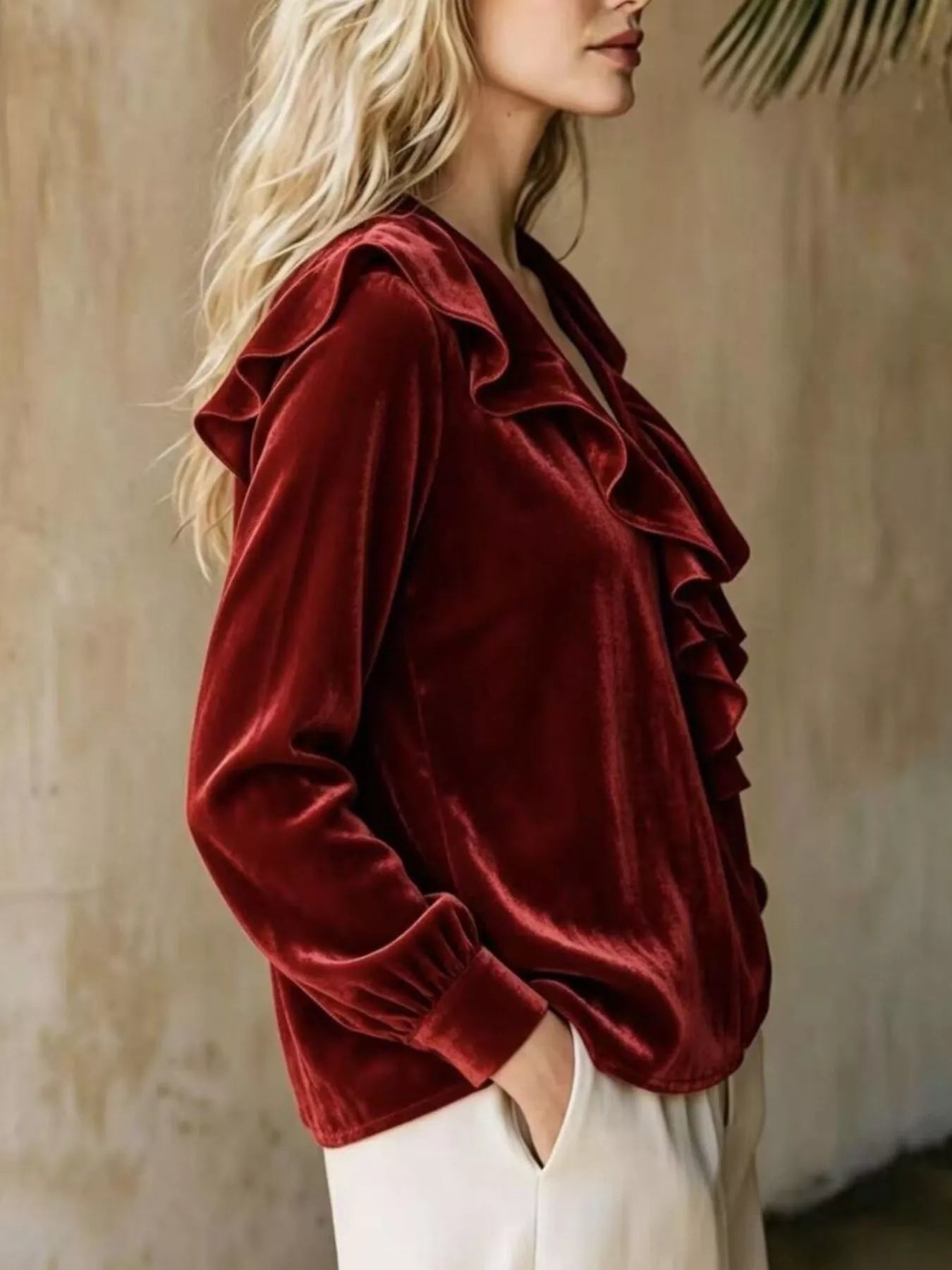 Plus size long sleeve V-neck ruffled blouse by Trendsi, featuring a flattering fit and feminine ruffle details, shown in full view.