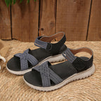 Women's open toe woven strap flat sandals by Trendsi, featuring faux leather slides with a comfortable design and stylish open toe style.