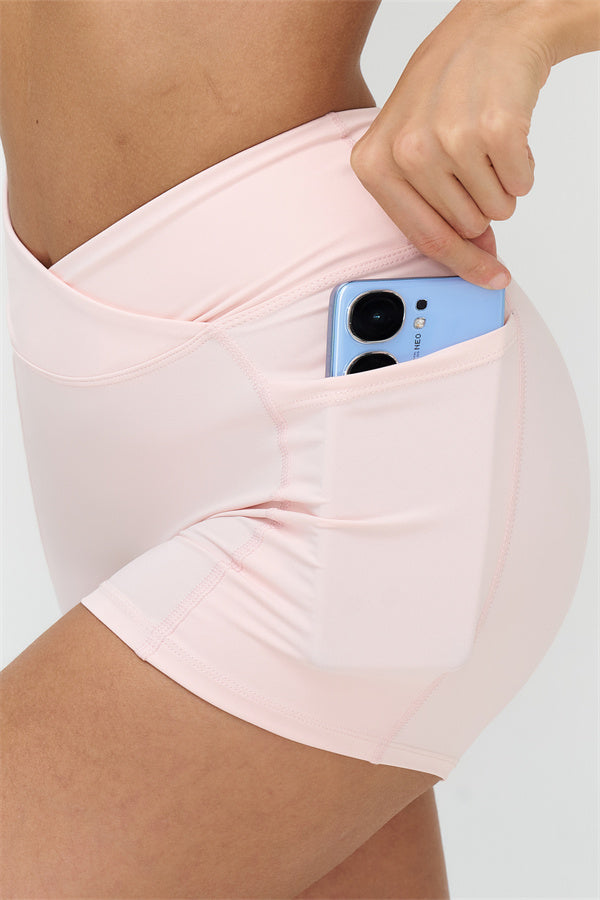 Fitglutes Activewear crop top and shorts 2-piece set, stylish gymwear and workout clothes for active women, black and pink color combination.