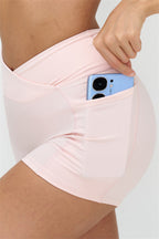 Fitglutes Activewear crop top and shorts 2-piece set, stylish gymwear and workout clothes for active women, black and pink color combination.