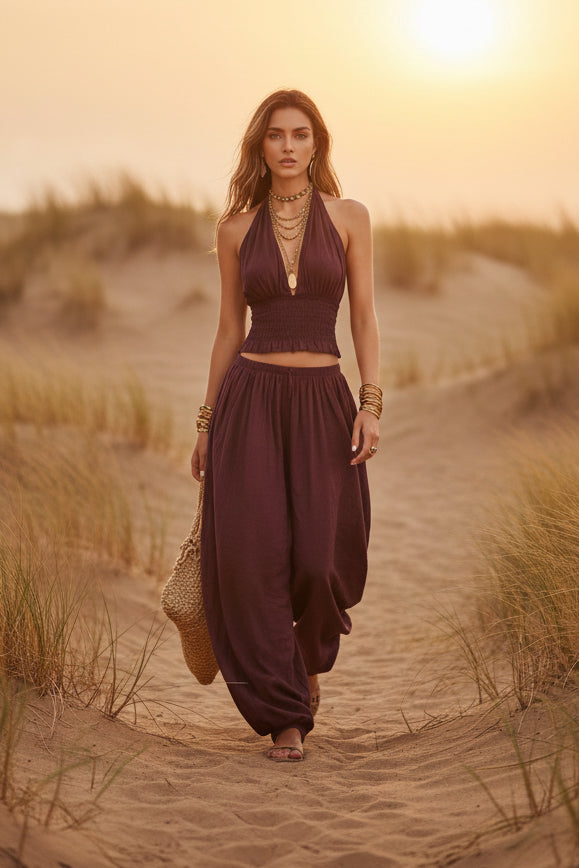 Women's sleeveless backless halter top and wide-leg pants set by FitiqueFit, featuring a stylish, relaxed fit with modern design.