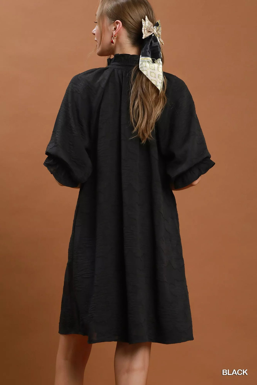 Umgee floral textured jacquard V-neck dress with a flowy silhouette and vibrant floral pattern, perfect for casual or semi-formal occasions.