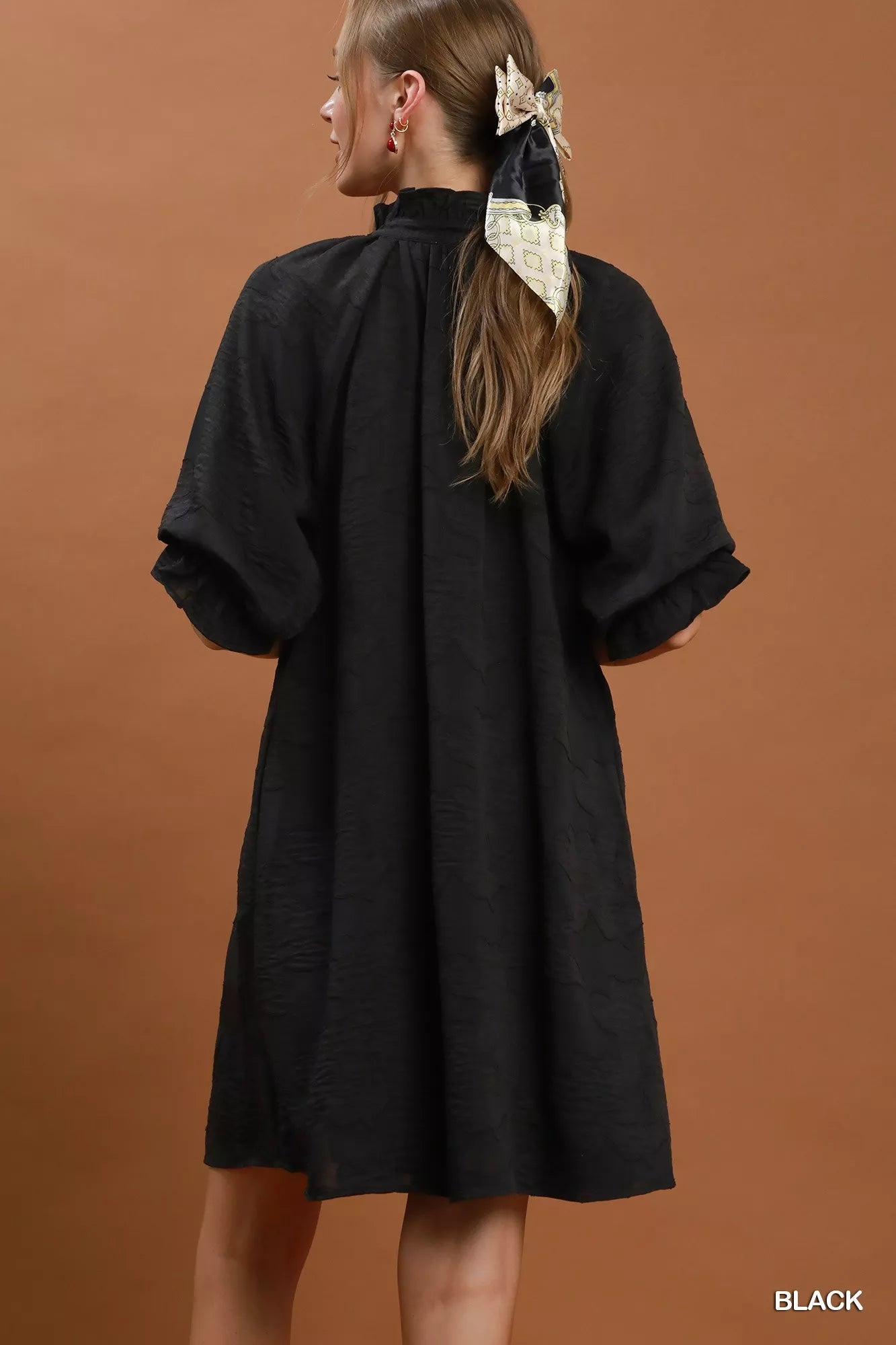Umgee floral textured jacquard V-neck dress with a flowy silhouette and vibrant floral pattern, perfect for casual or semi-formal occasions.