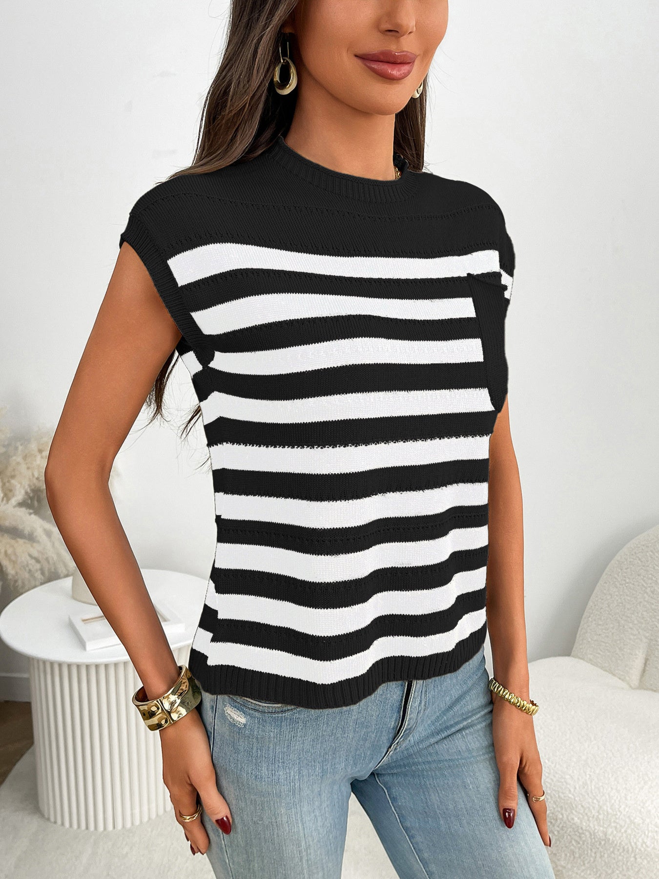 Women's striped knit cap sleeve sweater with pocket detail, casual outerwear from Trendsi, shown on a mannequin.