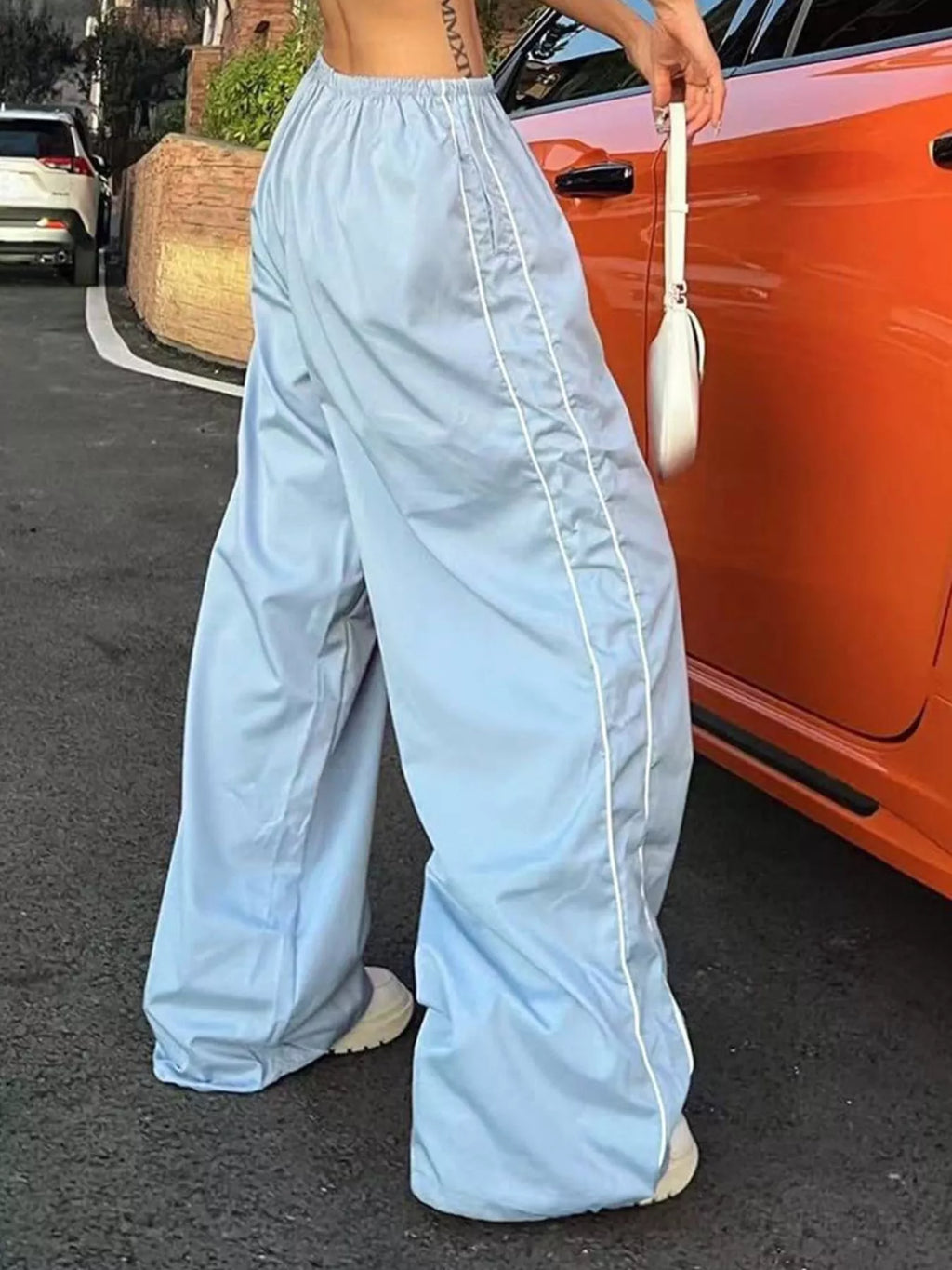 Women's high-rise wide-leg dress pants with lightweight fabric and elastic waist, stylish and comfortable for casual wear.