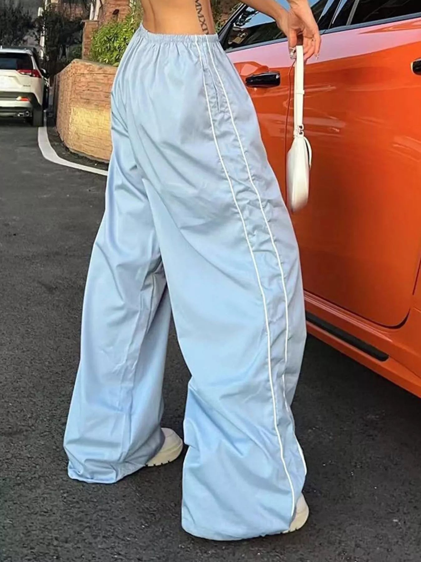 Women's high-rise wide-leg dress pants with lightweight fabric and elastic waist, stylish and comfortable for casual wear.