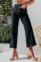 High-waisted button-fly wide-leg jeans by Trendsi, showing the denim with front buttons and relaxed fit on a model.