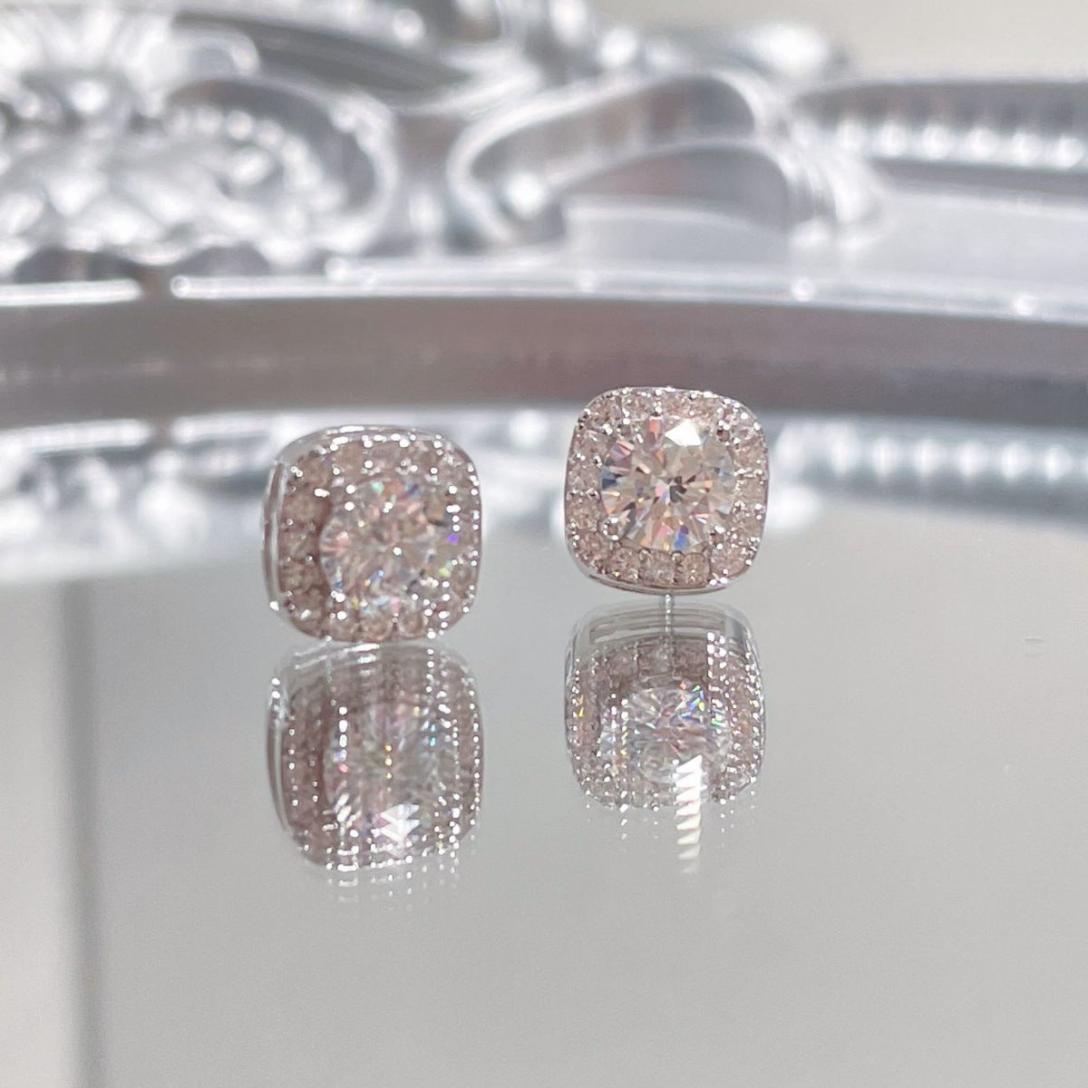 Sterling silver stud earrings with 1 carat moissanite gemstones, crafted by Plush Fashion Hub.
