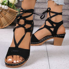 Women's chic lace-up block heel sandals by Trendsi featuring stylish strappy design and mid-height heels.