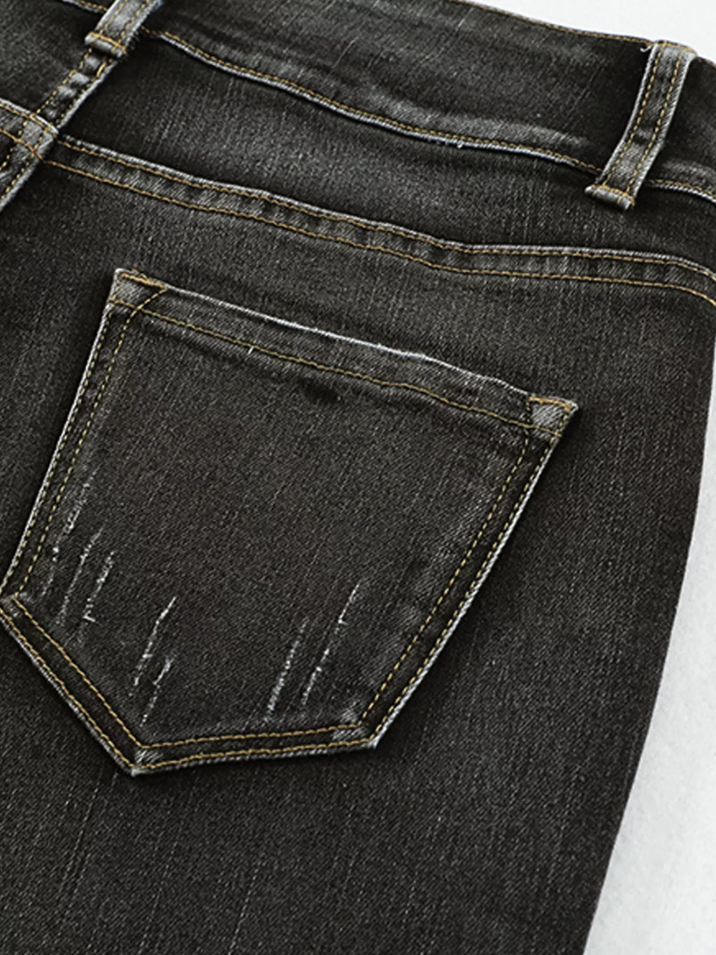 High waist distressed straight leg jeans by Trendsi, showing front view with ripped details and classic denim texture.
