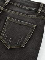 High waist distressed straight leg jeans by Trendsi, showing front view with ripped details and classic denim texture.