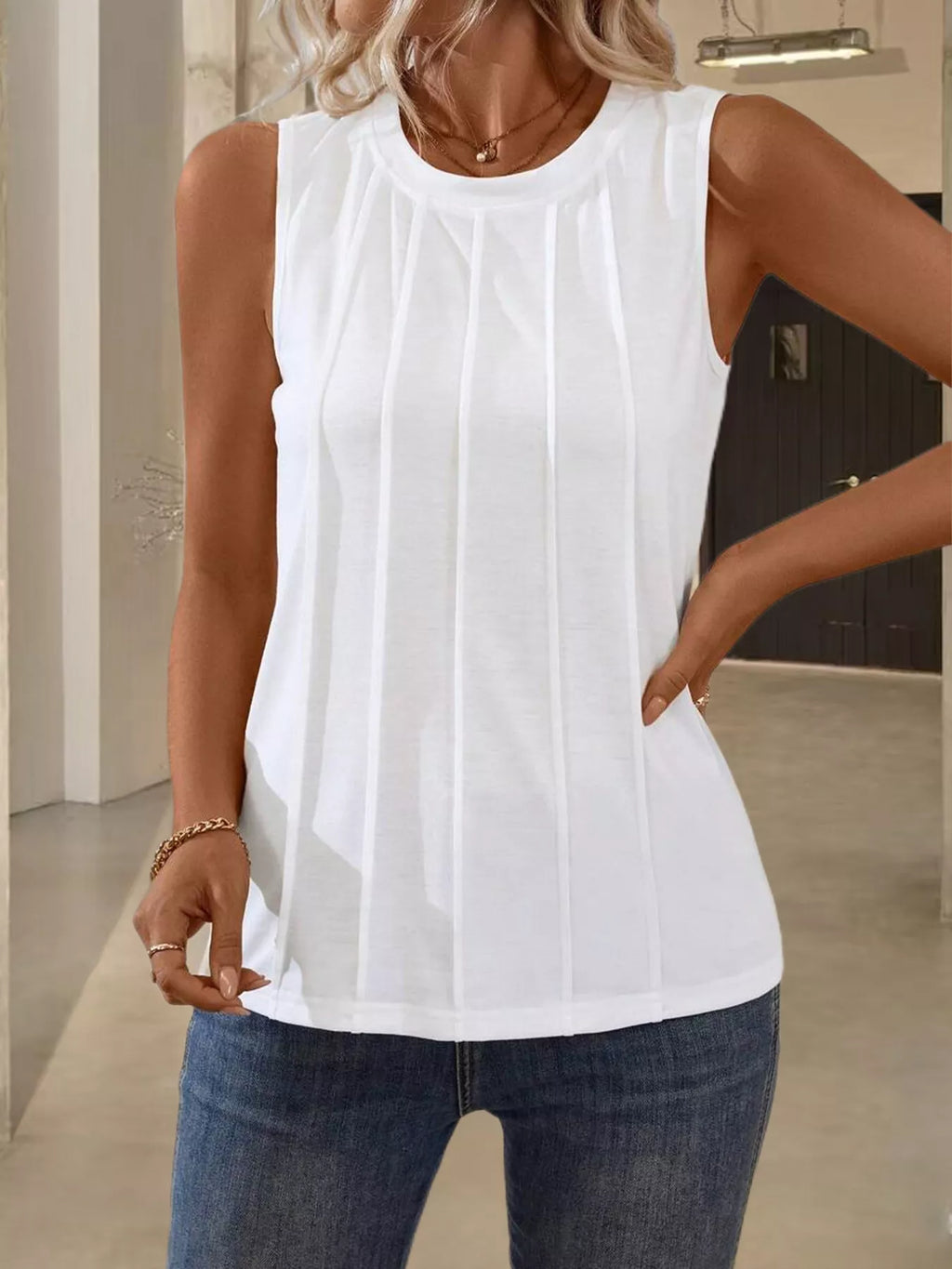 White round neck tank top from Trendsi, casual sleeveless top with a fitted design and smooth fabric.