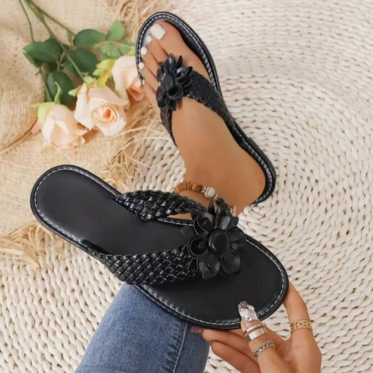 Plush Fashion Hub floral accent braided thong sandals with colorful straps and flat sole, perfect for summer wear.